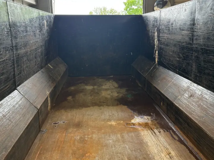 Inside the empty 21-yard junk removal dumpster, 14 by 7 by 6 feet